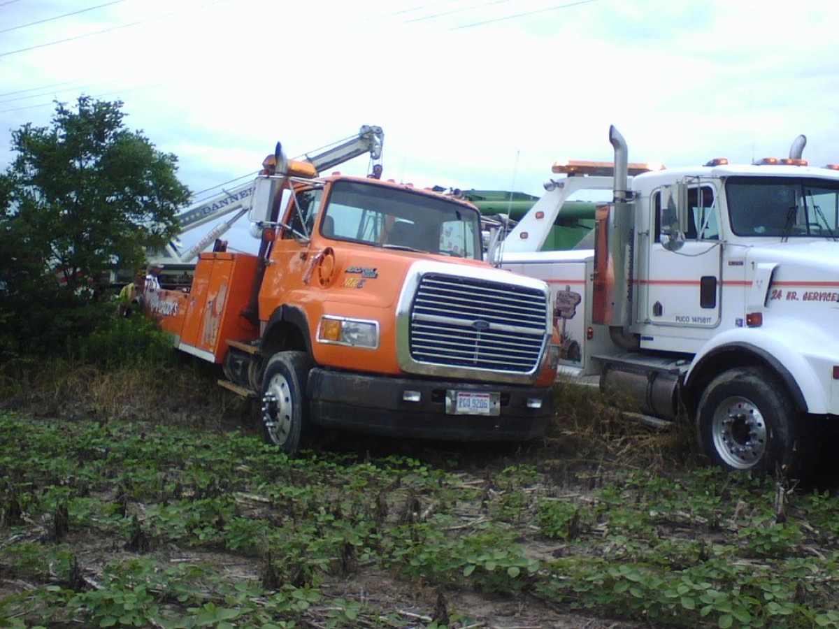 Big Daddy's wrecker recovering a vehicle from a field
